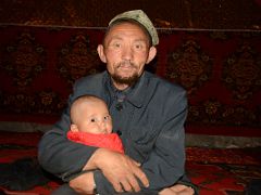 06 Yilik Headman With His Grandchild On The Way To K2 China Trek